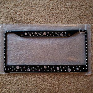 Metal license plate holder with crystals